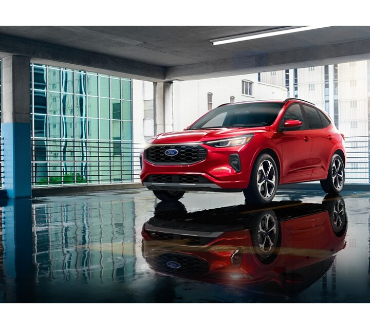 A 2024 Ford Escape® ST-Line Elite parked in an immaculate urban garage complex