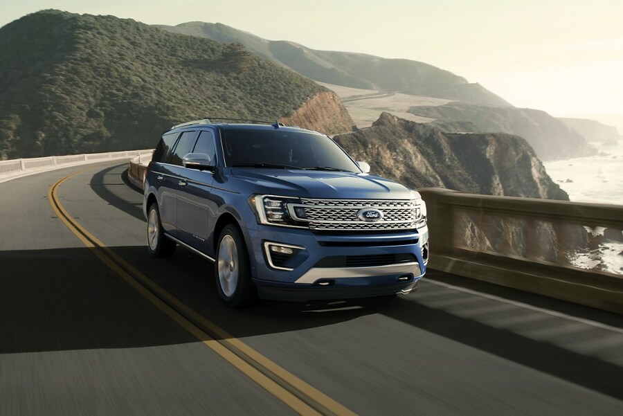 2021 Ford Expedition shown driving on a city highway