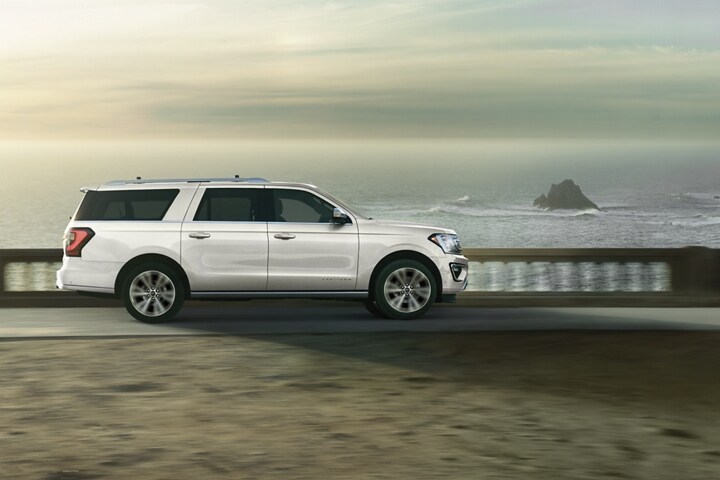 2021 Ford Expedition Platinum being driven along an ocean road