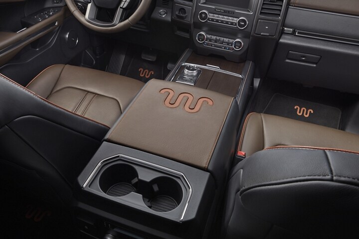 Distinctive 2021 Ford Expedition King Ranch centre console with Ziricote wood veneer with covered and uncovered beverage holders