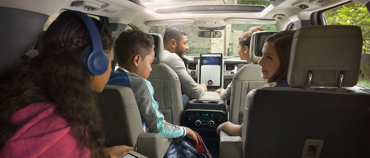 A family of five sitting in a 2023 Ford Expedition SUV
