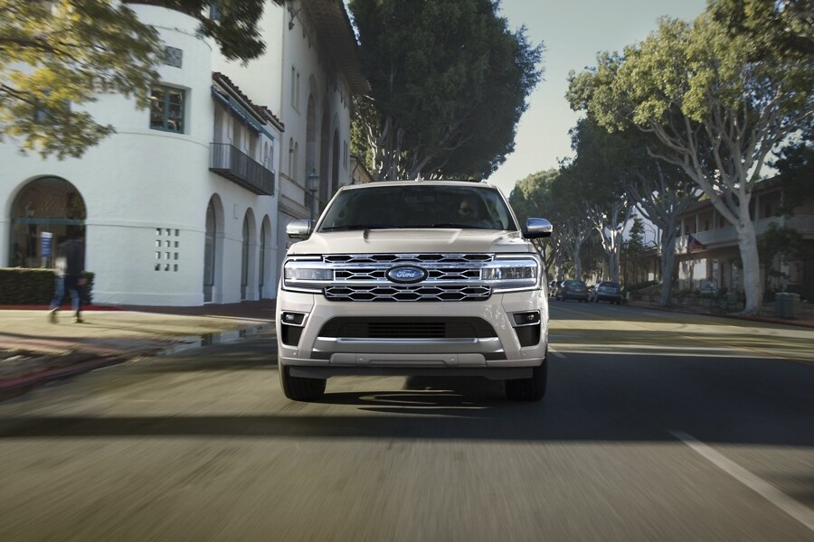 A 2023 Ford Expedition Platinum being driven on scenic street