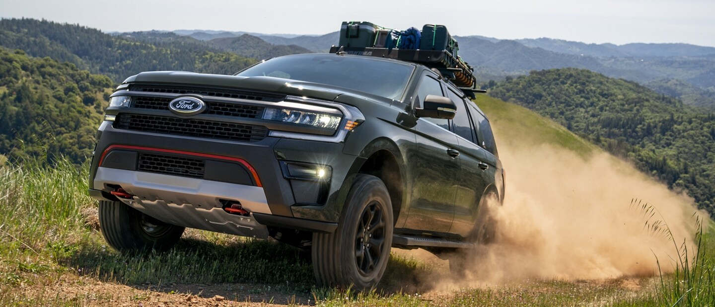 A 2023 Ford Expedition SUV being driven up a mountainous dirt path