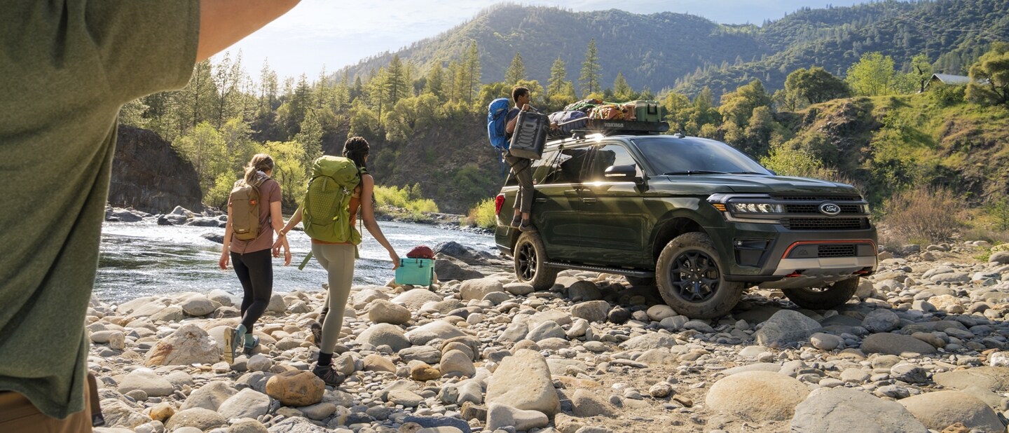 A 2023 Ford Expedition SUV Timberline parked next to a river