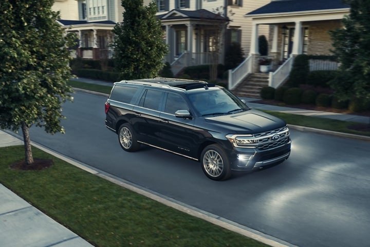 A 2023 Ford Expedition SUV being driven down a suburban road