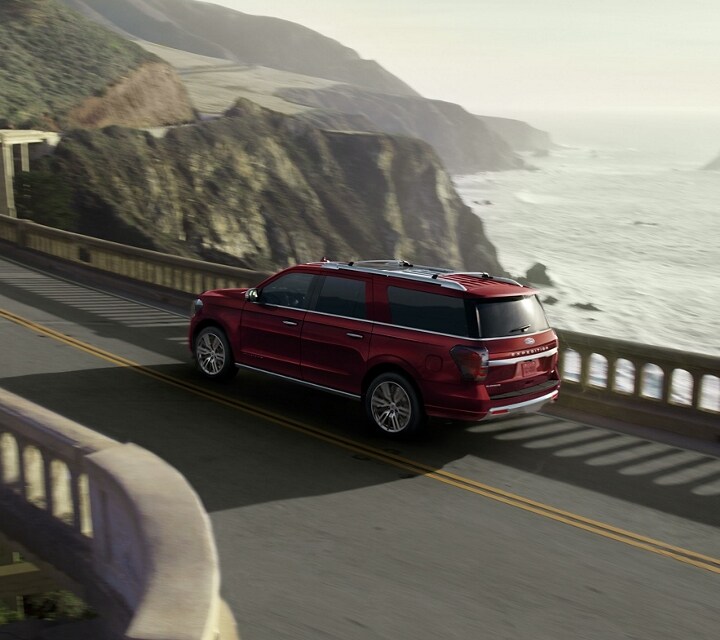 A 2023 Ford Expedition SUV being driven over a bridge