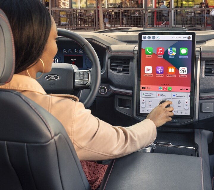 Interior shot of woman interacting with touchscreen