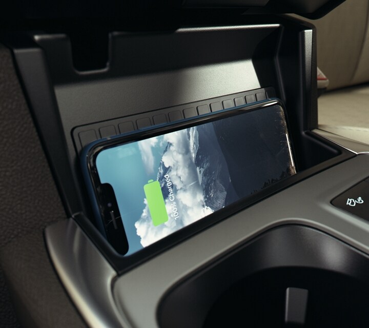 2023 Ford Explorer® SUV interior with a smartphone lying sideways on the wireless charging pad