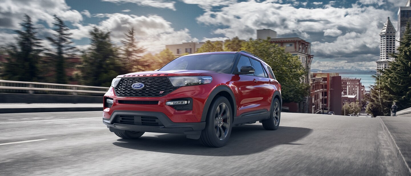 2023 Ford Explorer® ST model being driven away from a town