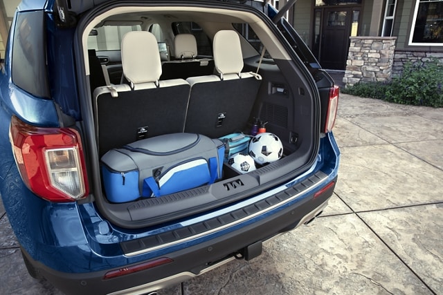 2023 Ford Explorer® SUV carrying a cooler and soccer equipment in the cargo area