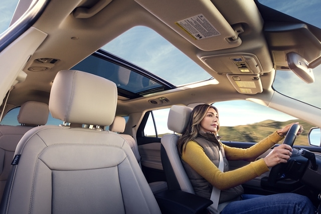 2023 Ford Explorer® SUV interior with twin-panel moonroof with person driving