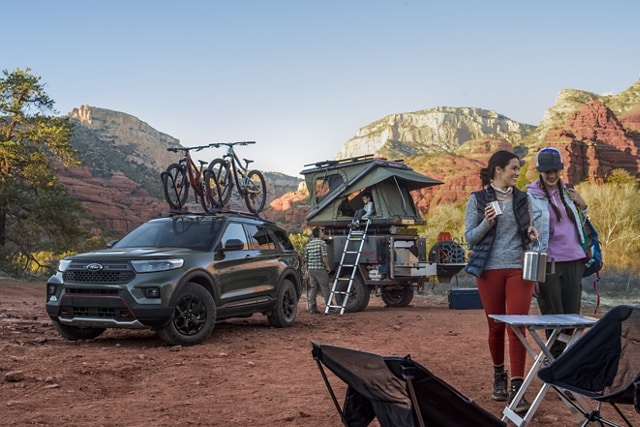 2023 Ford Explorer® Timberline® SUV with roof-mounted bike rack parked at a campsite