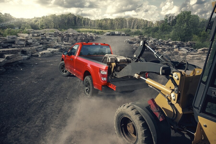 2023 Ford F-150® truck being loaded with large stones in a quarry
