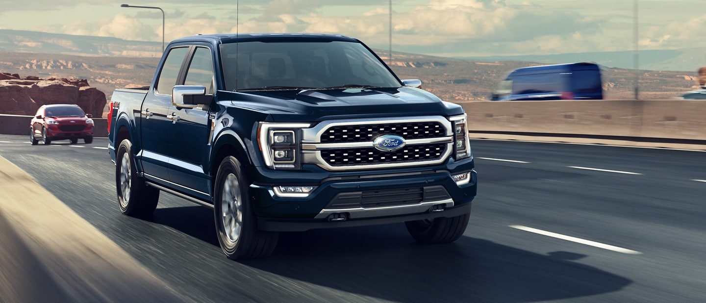 A 2023 Ford F-150® pickup being driven on a highway
