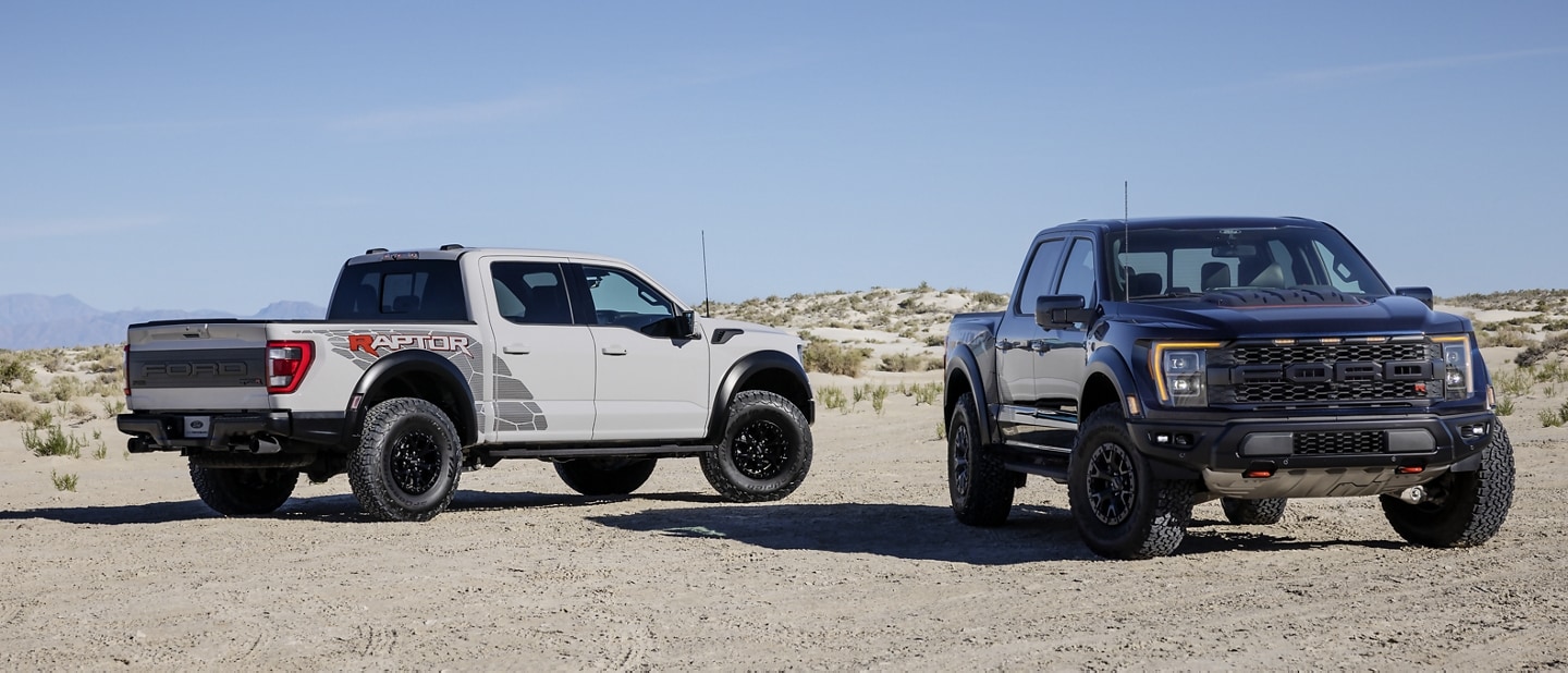 2023 Ford F-150® Raptor® and Raptor® R trucks parked in the desert