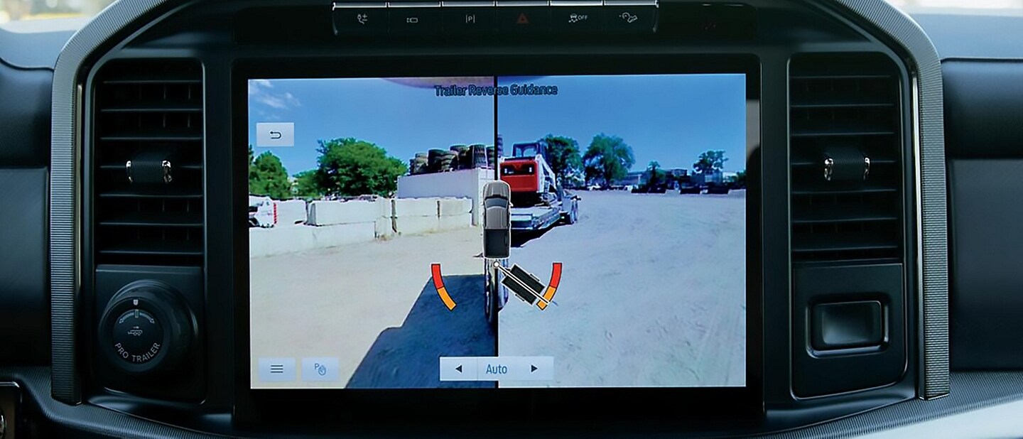 Close-up of a 2023 Ford F-150® truck aligning the hitch ball to a trailer hitch