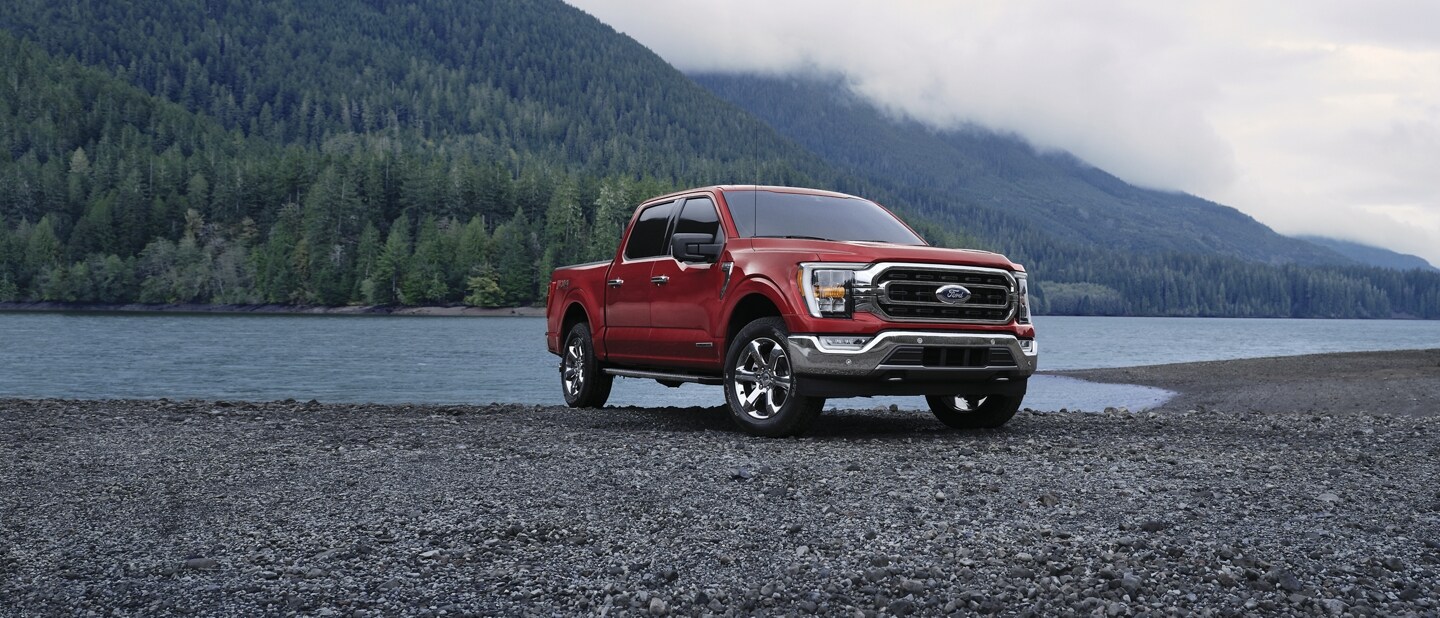 2023 Ford F-150® XLT pickup parked near a mountain lake