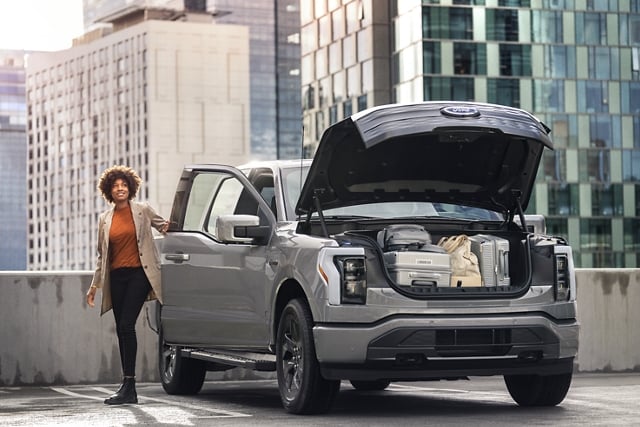The 2023 Ford F-150® Lightning® showing the Mega Frunk open with luggage inside