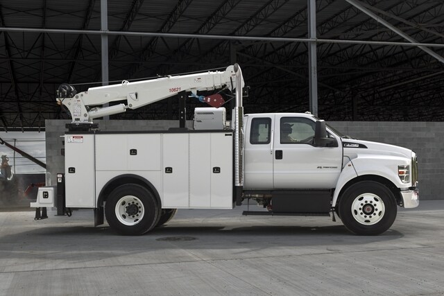 2023 Ford F-750 SuperCab in Oxford White with mechanic truck upfit parked at building site