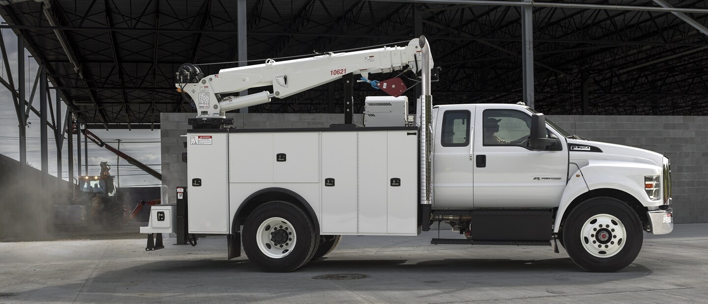 2024 Ford F-750 SuperCab in Oxford White with mechanic truck upfit parked at building site