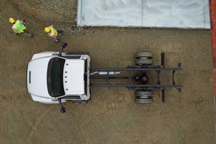 Aerial view of workers near 2024 Ford F-750 Regular Cab with chassis