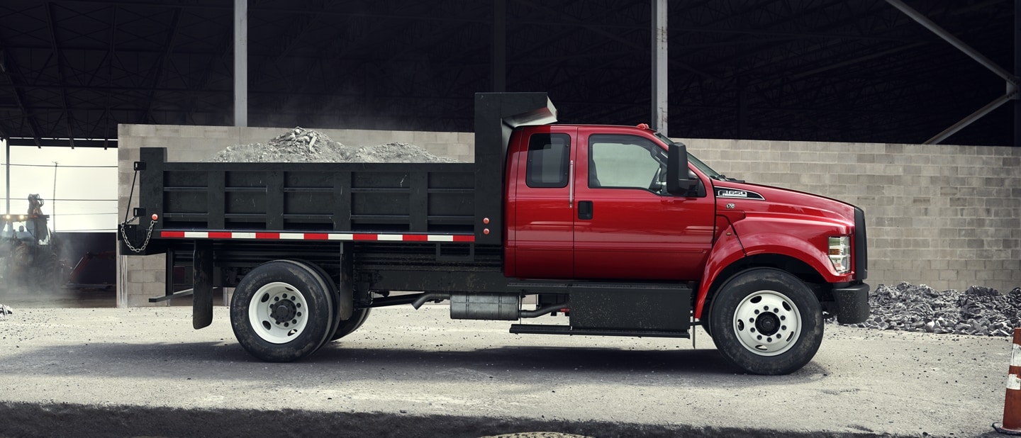 2025 Ford F-650 SuperCab shown in Race Red with dump truck upfit