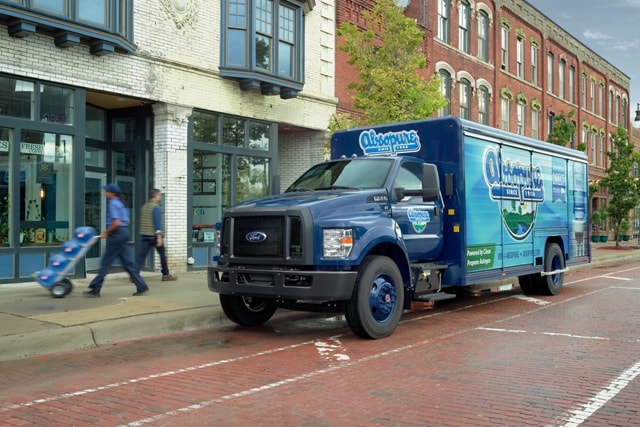 2025 Ford F-750 Regular Cab with beverage truck upfit and custom design on city street