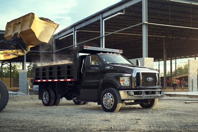 2025 Ford F-750 Regular Cab in Agate Black with dump truck upfit at work site
