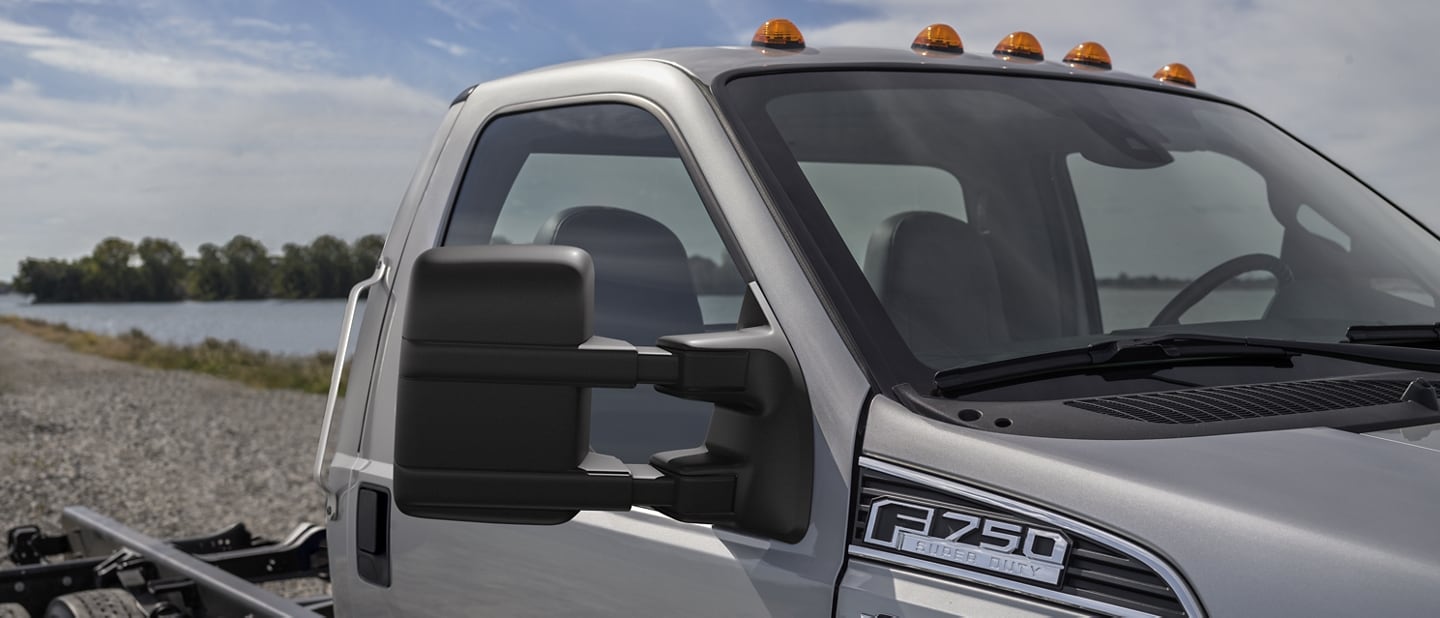 Close-up on passenger side mirror of the 2026 Ford F-750® shown in Iconic Silver