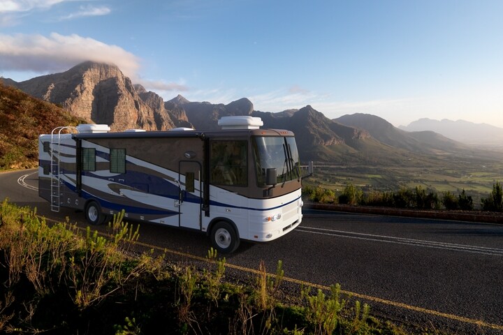 Class A Motorhome on a 2024 Ford F-53 Stripped Chassis being driven through mountains