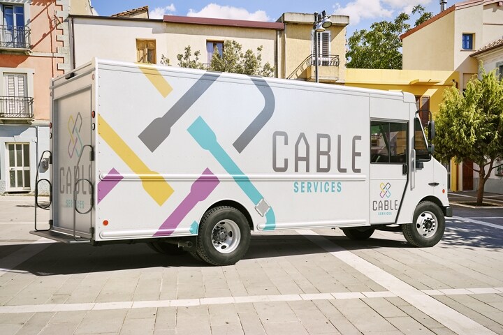A 2024 Ford F-59 Stripped Chassis with walk-in delivery van body and cable service design