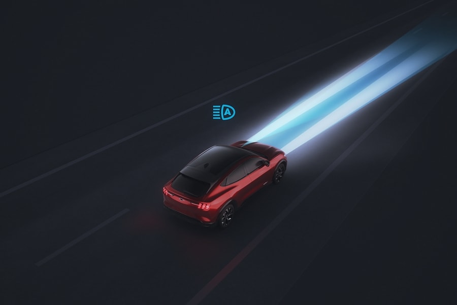Illustration of a 2023 Ford Mustang Mach-E® in the dark with the auto high-beam headlamps on