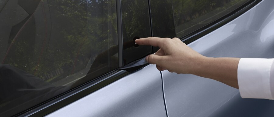 Finger pressing illuminated E-Latch on 2023 Ford Mustang Mach-E®
