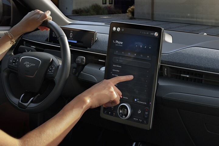 Person using the touchscreen in 2023 Ford Mustang Mach-E®