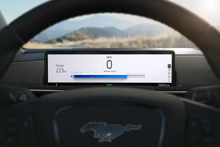 Intelligent Range display behind the wheel of a 2023 Ford Mustang Mach-E®