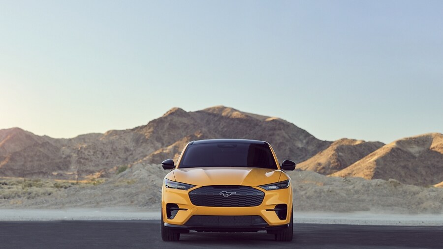 Front view of a 2023 Ford Mustang Mach-E® parked with mountains in the background