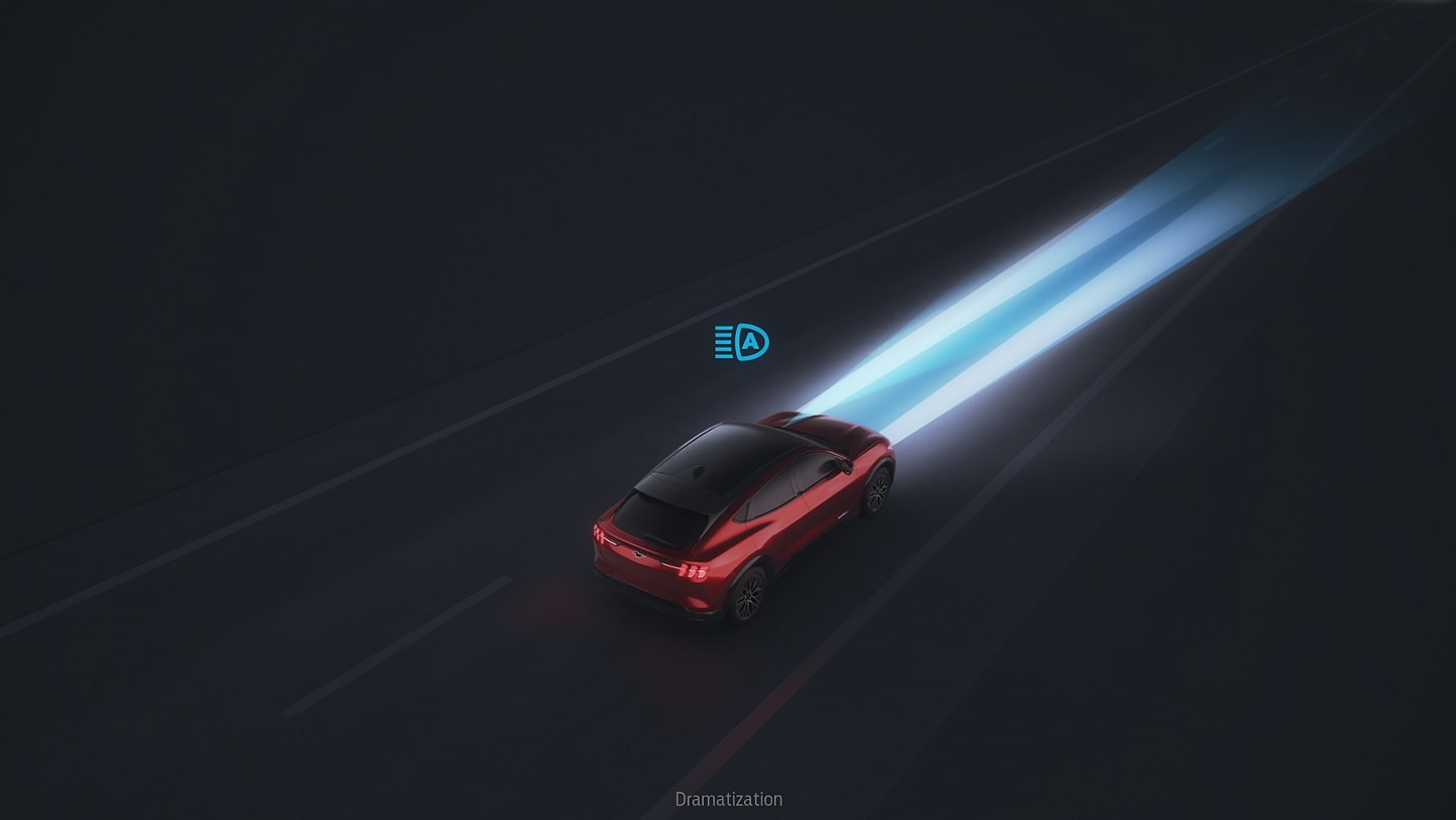 2024 Ford Mustang Mach-E® being driven down the highway at night