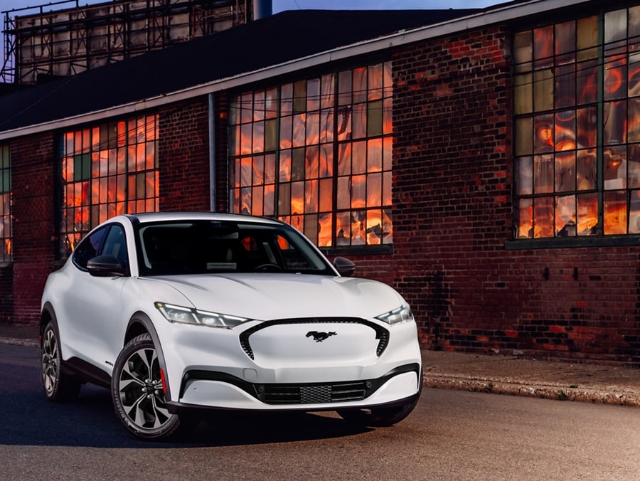 2024 Ford Mustang Mach-E® parked in front of an industrial building