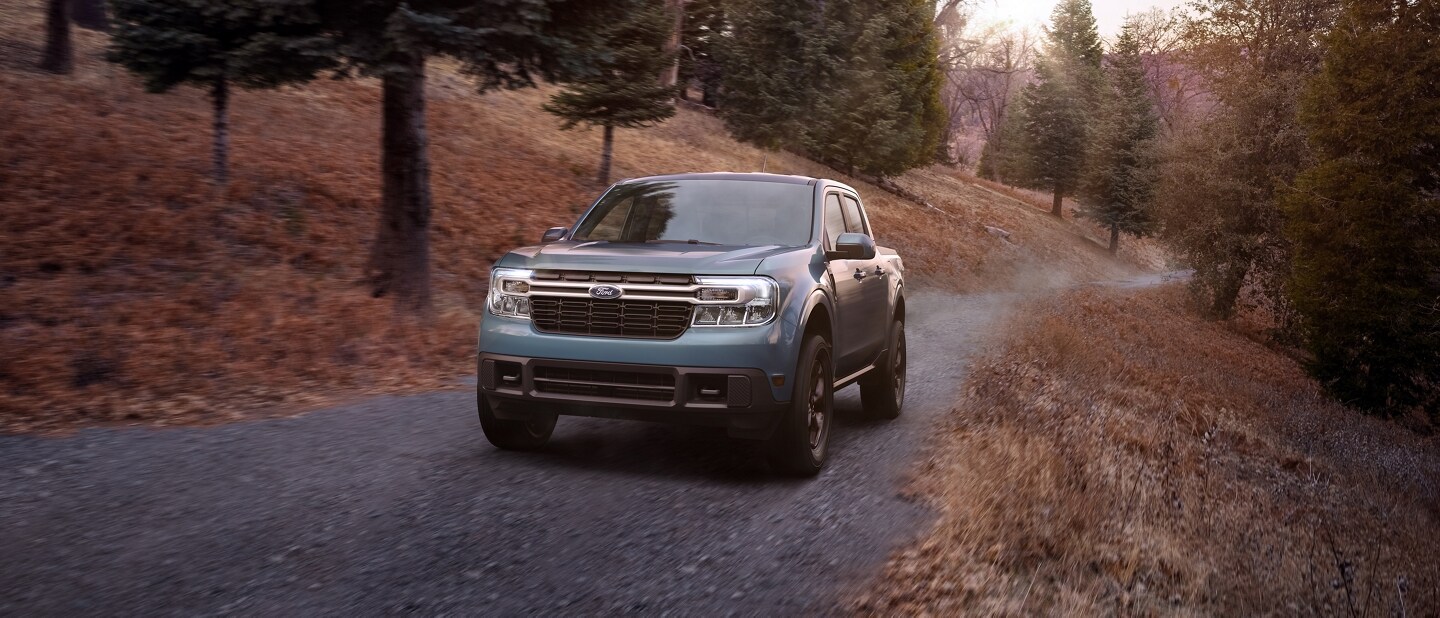 2023 Ford Maverick® truck with available FX4 Off-Road Package being driven on a gravel road
