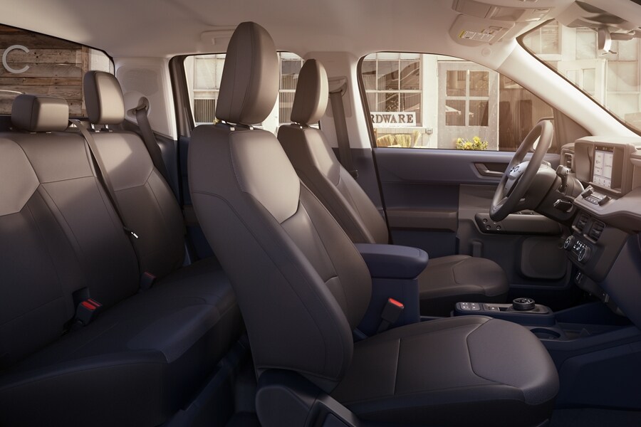 Interior of the 2023 Ford Maverick® XL truck with a hardware store visible through the driver’s side window