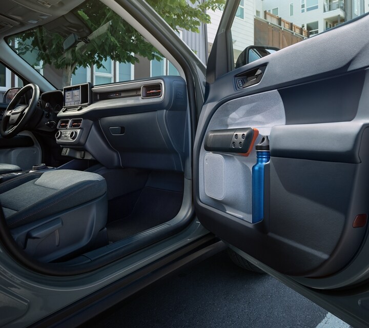 A 2024 Ford Maverick® truck with the passenger driver door open with a view of the interior