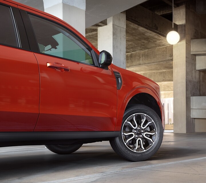 A 2024 Ford Maverick® truck parked in a garage with a view of the wheel
