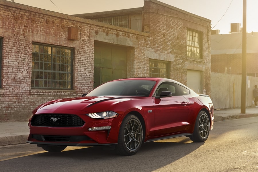 2023 Ford Mustang® coupe in Race Red parked on a street