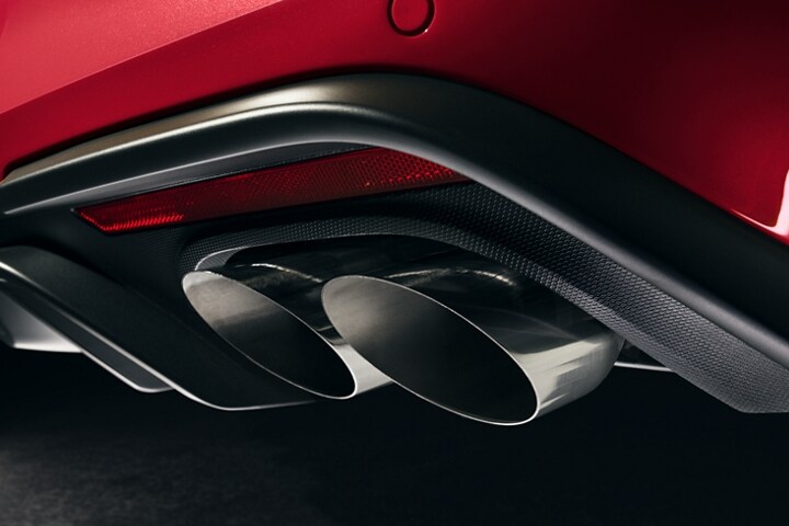 Close-up of the rear of a 2023 Ford Mustang® GT model with dual exhaust and quad tips