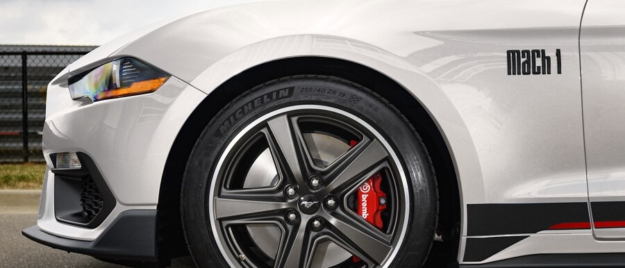 Close-up of 2023 Ford Mustang® Mach 1® coupe front wheel showing Brembo™ brake on larger calliper