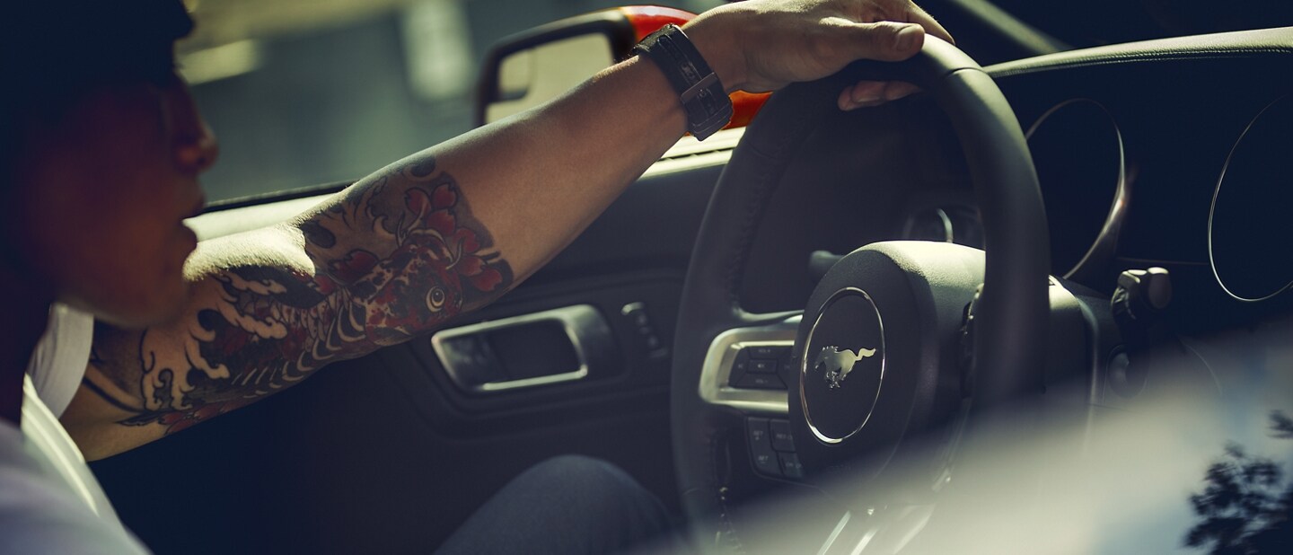 2023 Ford Mustang® coupe interior with a person driving