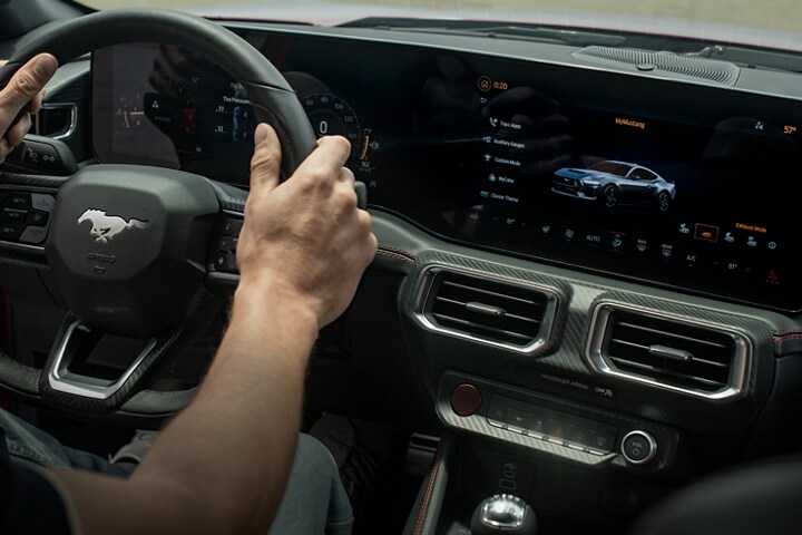 Person driving a 2024 Ford Mustang® model
