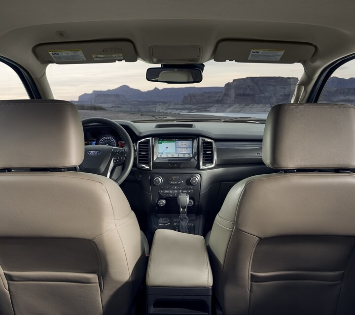 Interior look at a 2021 Ford Ranger LARIAT cab in Medium Stone