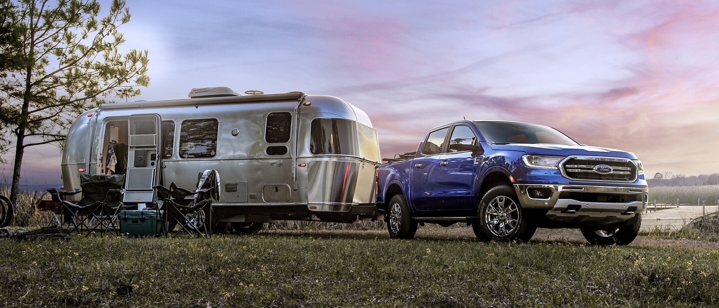 2023 Ford Ranger® in Velocity Blue parked with trailer attached