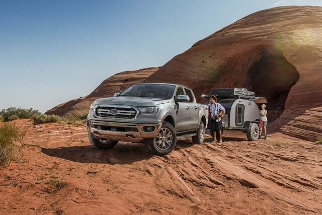 2023 Ford Ranger® parked in the desert with a couple unloading camping gear